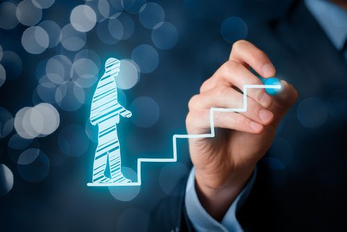 a man drawing a stair up arrow with marker