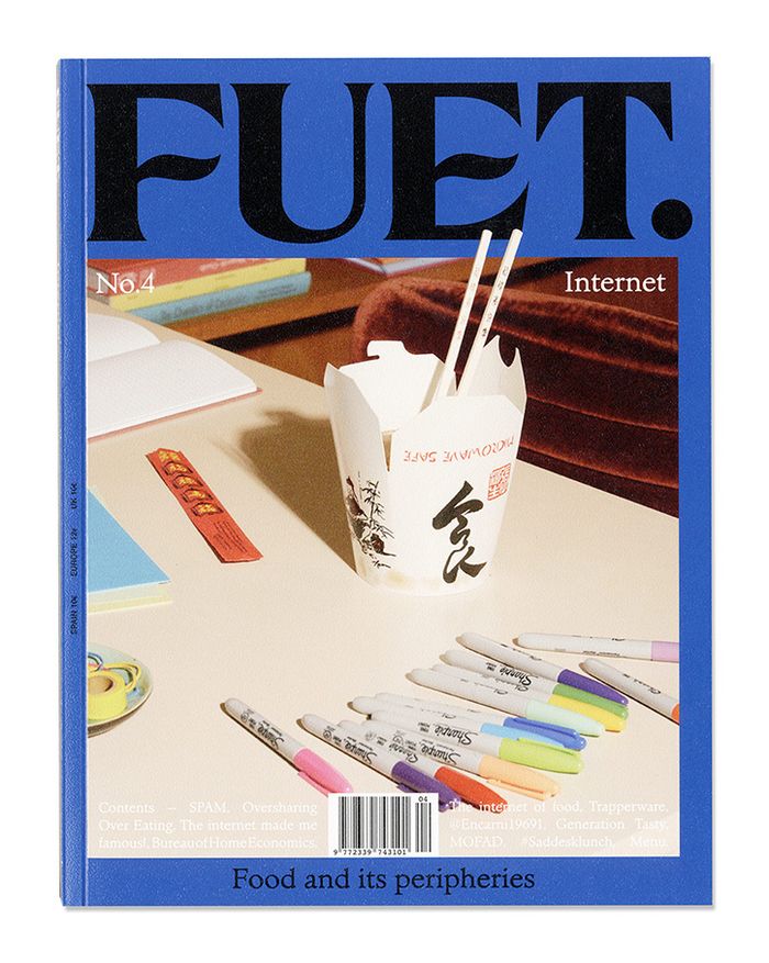 a magazine cover with pens and paper in it