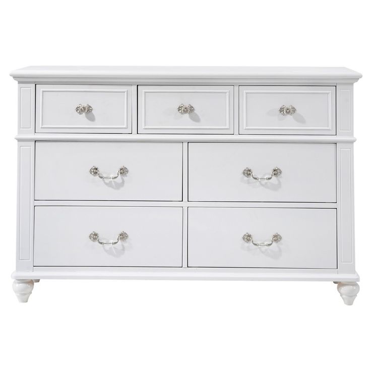 a white dresser with drawers and knobs