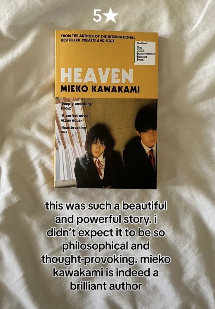 the book is laying on a bed with white sheets and an image of two men in suits