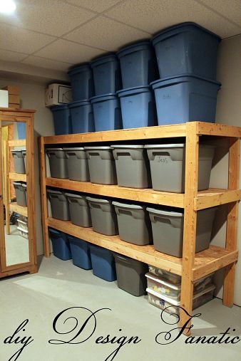 an organized storage room with blue and gray buckets