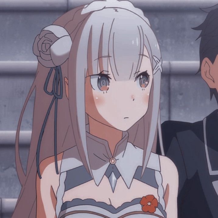 two anime characters standing next to each other in front of a metal wall and stairs