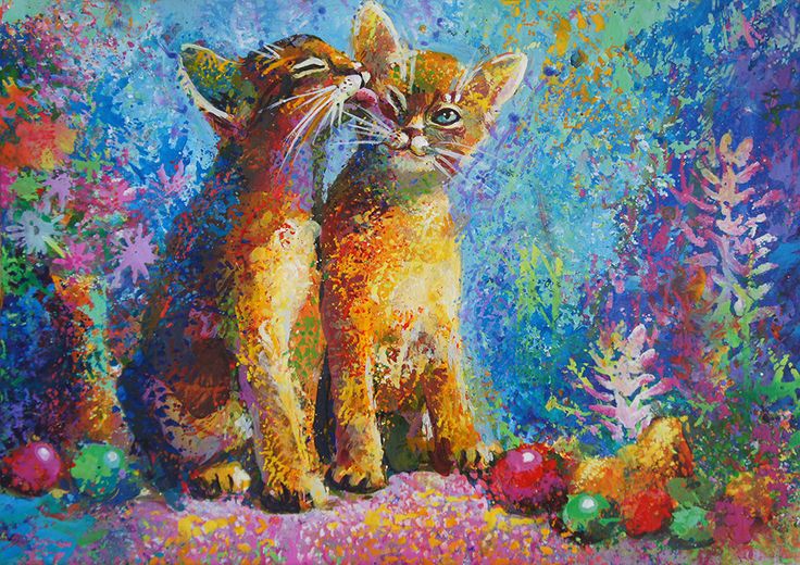 two cats sitting next to each other on top of a colorful surface with flowers and balls