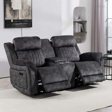 the reclining loveseat has two seats and is in front of a large window