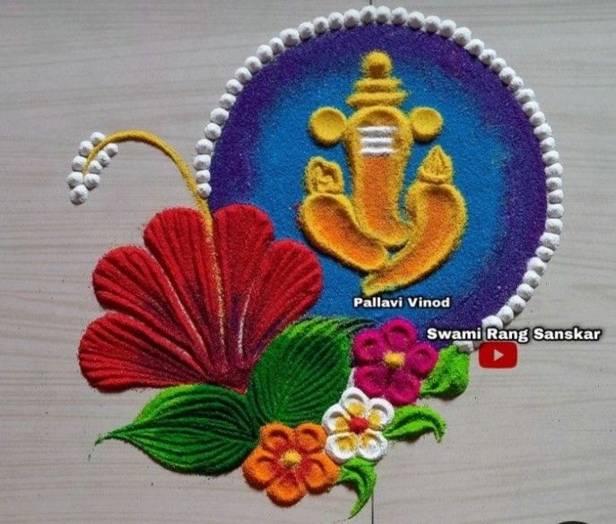 an embroidered badge with flowers and leaves on the side of a wooden surface, depicting ganeshi