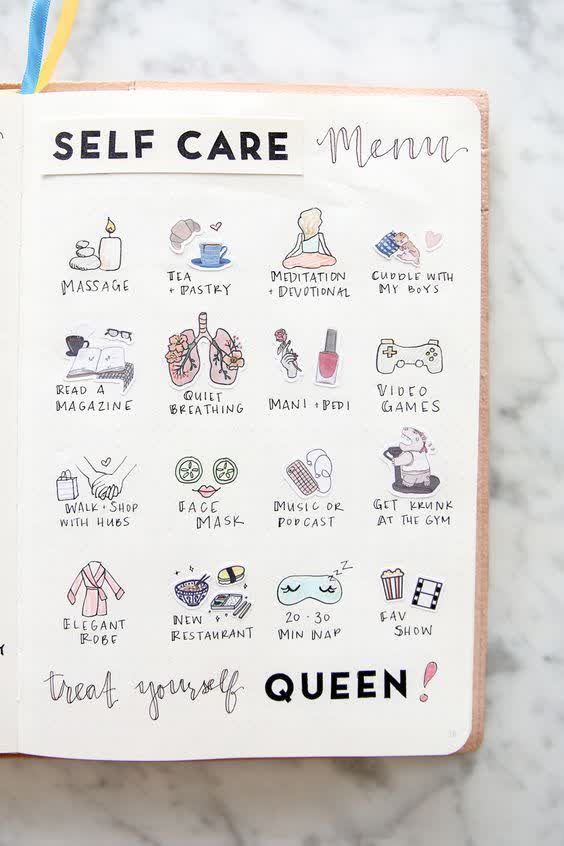 an open notebook with the words self care written on it and various stickers attached