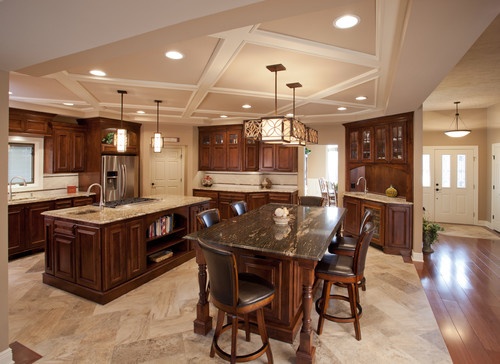 a large kitchen with an island in the middle and lots of counter space around it