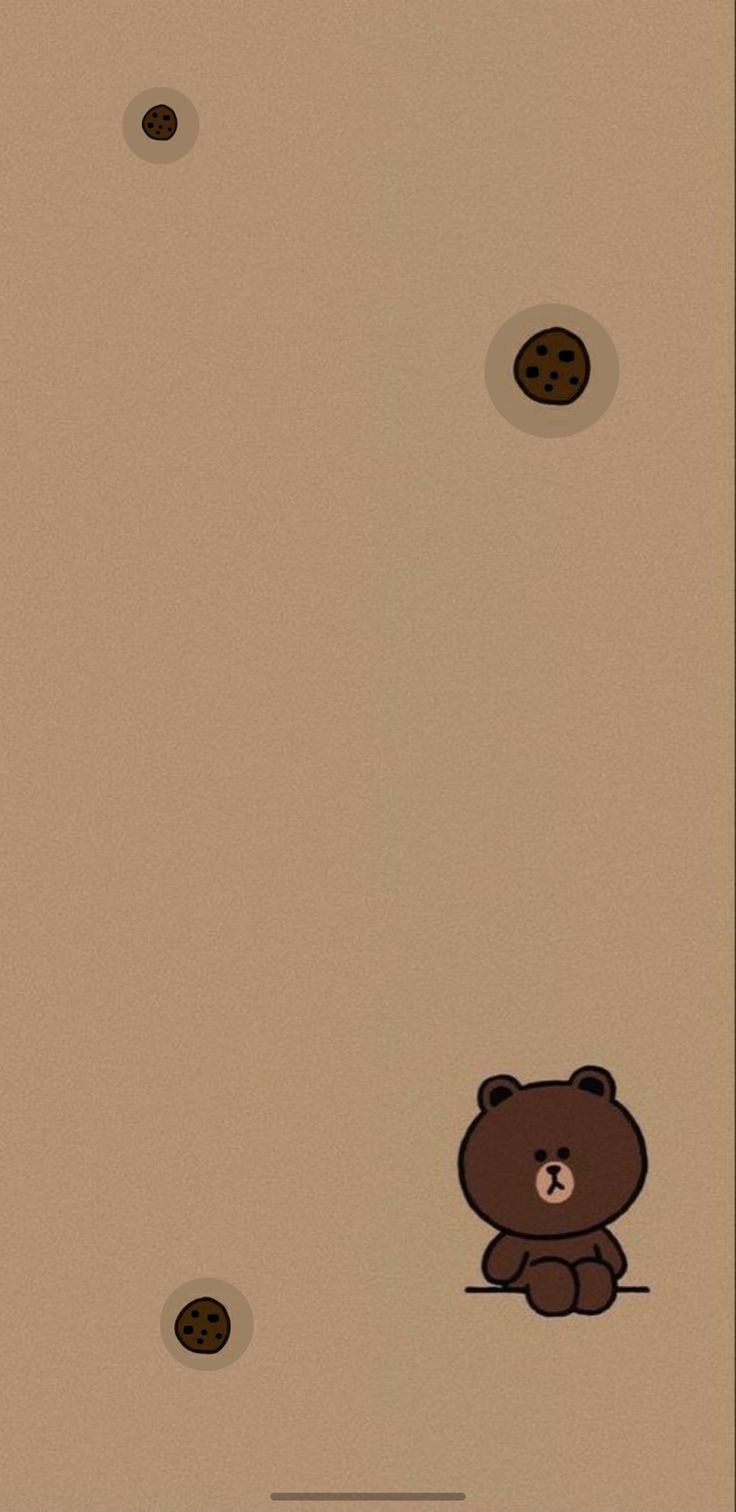 a brown teddy bear sitting on top of a floor next to two holes in the wall