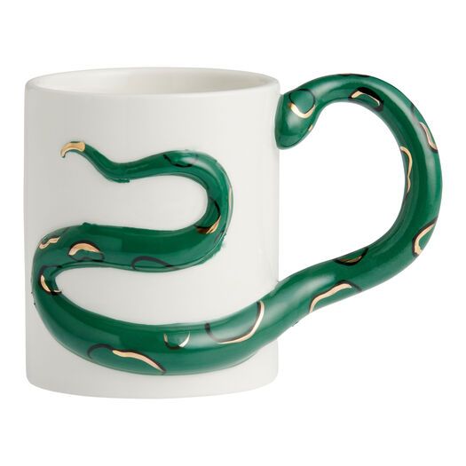 a white and green coffee cup with a snake on it