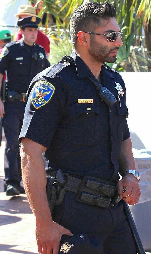 a police officer standing in front of other officers