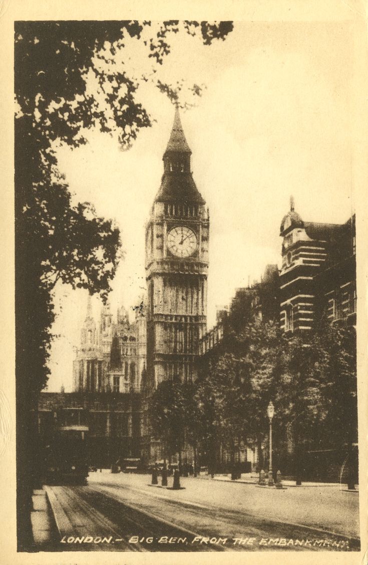 the big ben clock tower towering over the city of london, england in black and white