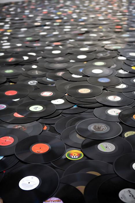 black and white photograph of records with the words music is the sound of the soul