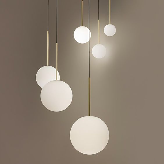 Bola sphere globe pendant light the minimalist and stylish design of the bola sphere globe pendant light makes it very popular. Its slender metal rod dangles from a thin fabric cord, leading to a sphere of milky opal glass. When lit, the light from the bola sphere pendant diffuses softly through the opaque glass, emitting a warm glow while providing plenty of indirect light to the environment. Featuring led lighting technology, bola sphere light is the perfect addition to the living room, bedroo Sphere Pendant Light, Sphere Light, Chrome Pendant Lighting, Globe Pendant Light, Brass Pendant Light, Globe Pendant, Spacious Living Room, Modern Pendant Light, Globe Lights