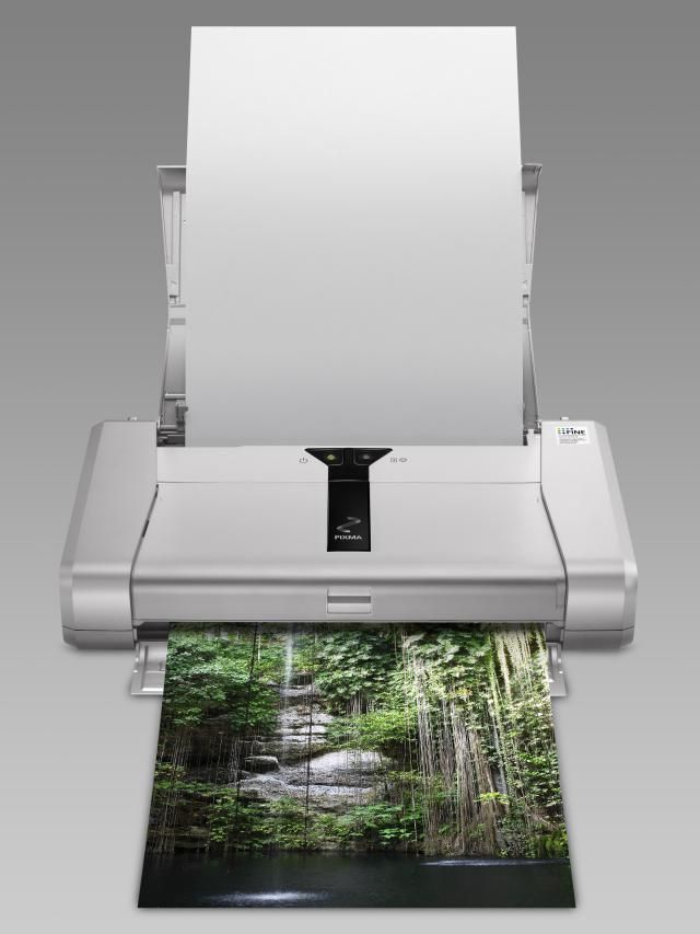 an image of a printer that is open to the screen and printing something on it