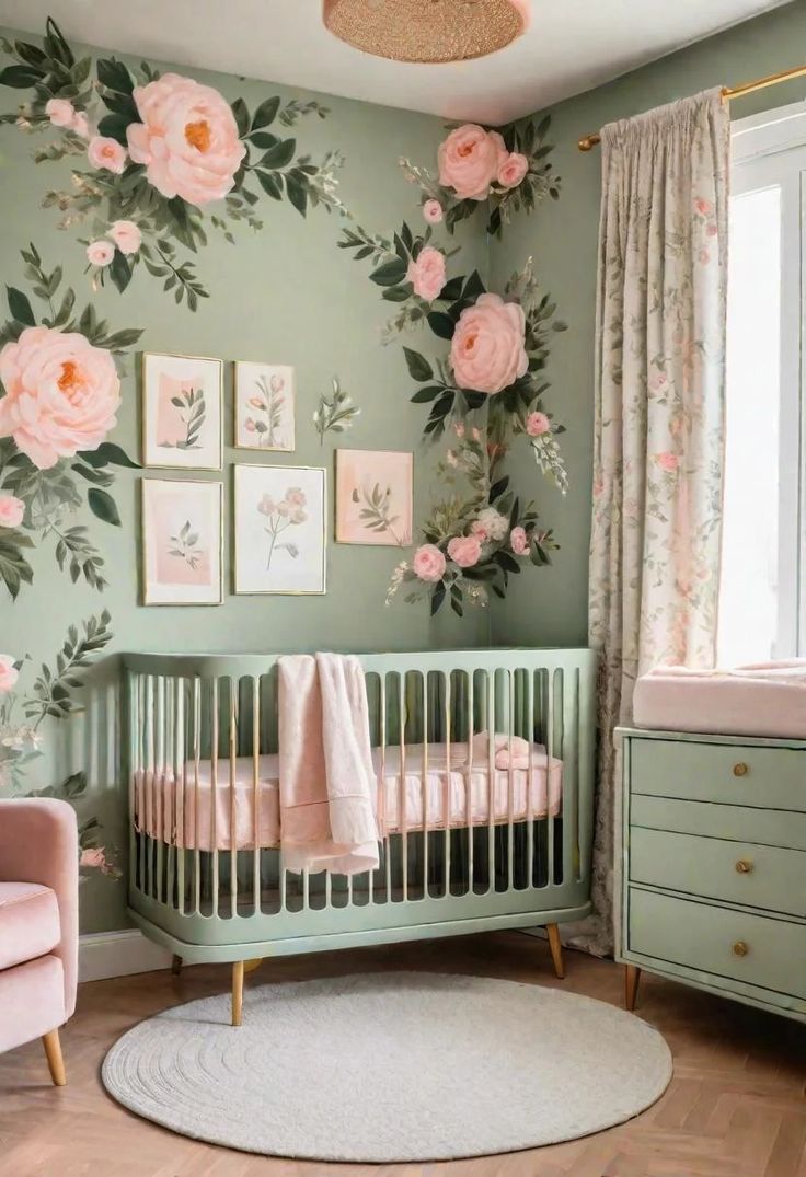 a baby's room with pink flowers on the wall and green crib bedding