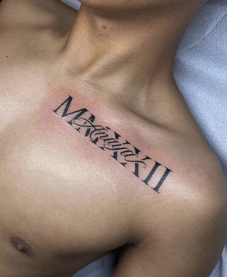 a man with a tattoo on his chest that reads messy messy 2 and has the word messy