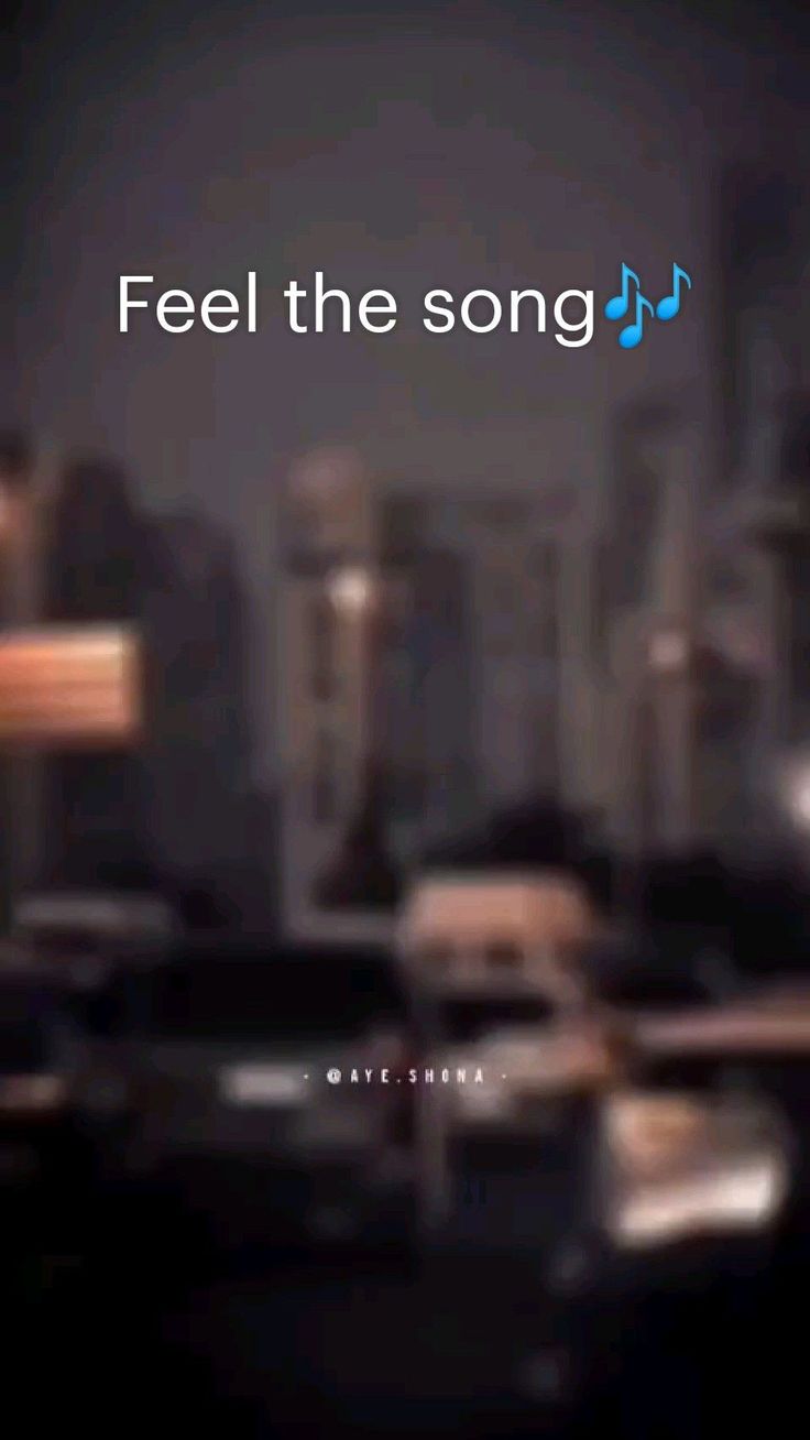 a blurry photo with the words feel the song