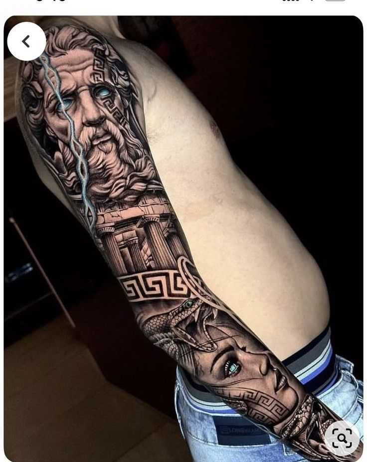 a man with a tattoo on his arm that has an image of jesus and the cross