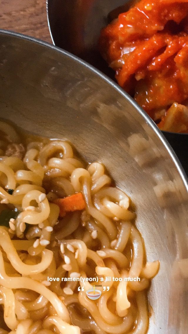 there is noodle and carrots in the bowl next to other food on the table