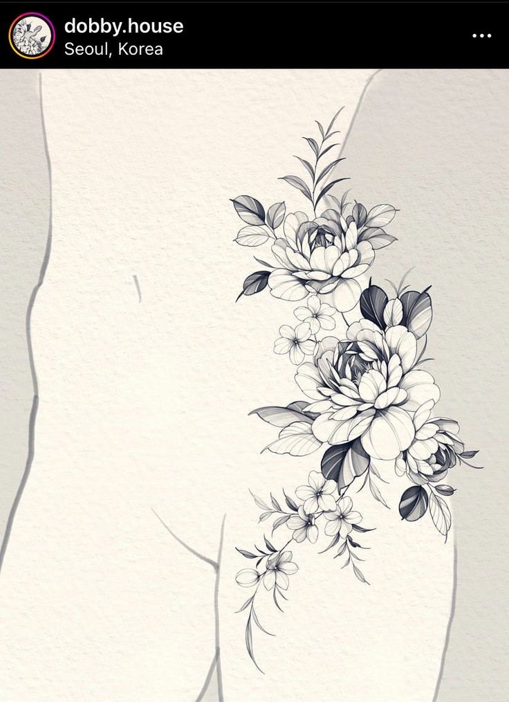 the back of a woman's stomach with flowers on it