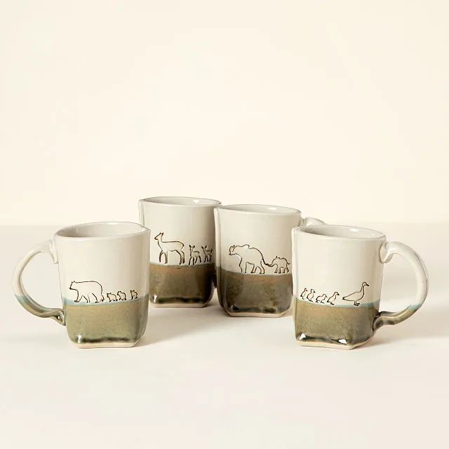 three coffee mugs sitting next to each other