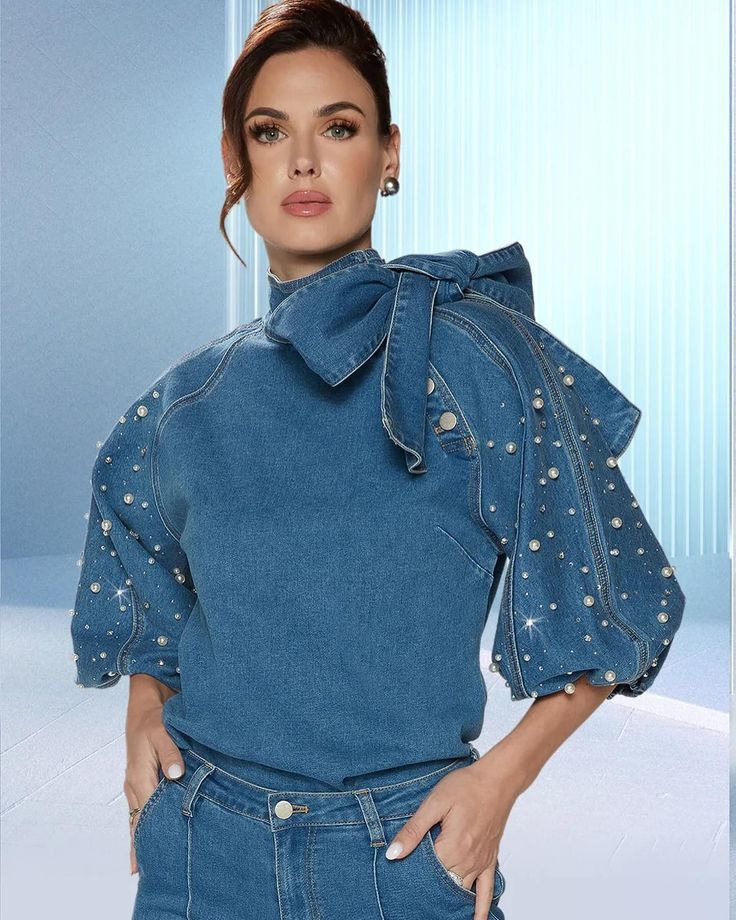 DV Jeans 8490 1 piece Rhinestone & Pearl Embellished Denim Top Colors: Blue Denim Top Length: 26” Sizes: S (4/6), M (8/10), L (12/14), XL (16/18), 1X (20/22), 2X (24/26) Matching Pant Available DV Jeans 8490-Pant https://www.divasdenfashion.com/products/dv-jeans-8490 #DivasDenFashion #denimtop #bluetop #denimpants #bellbottoms #bluedenim #denimblouse #pearls #rhinestones #bowtie #petitefashion #dvjeans #curvygirlsrock #lanternsleeves #mystylishcurves #plusstyle #workleisure #blacko... Denim Attire, Denim And Pearls, Blue Denim Top, Embellished Denim, Embellished Top, Matching Top, Upcycle Clothes, Denim Top, Denim Fashion