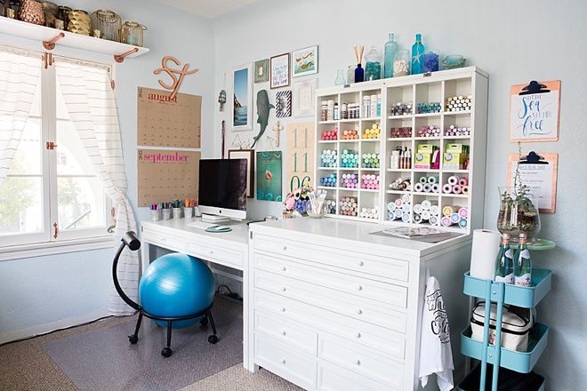 a room with a desk, shelves and a blue ball