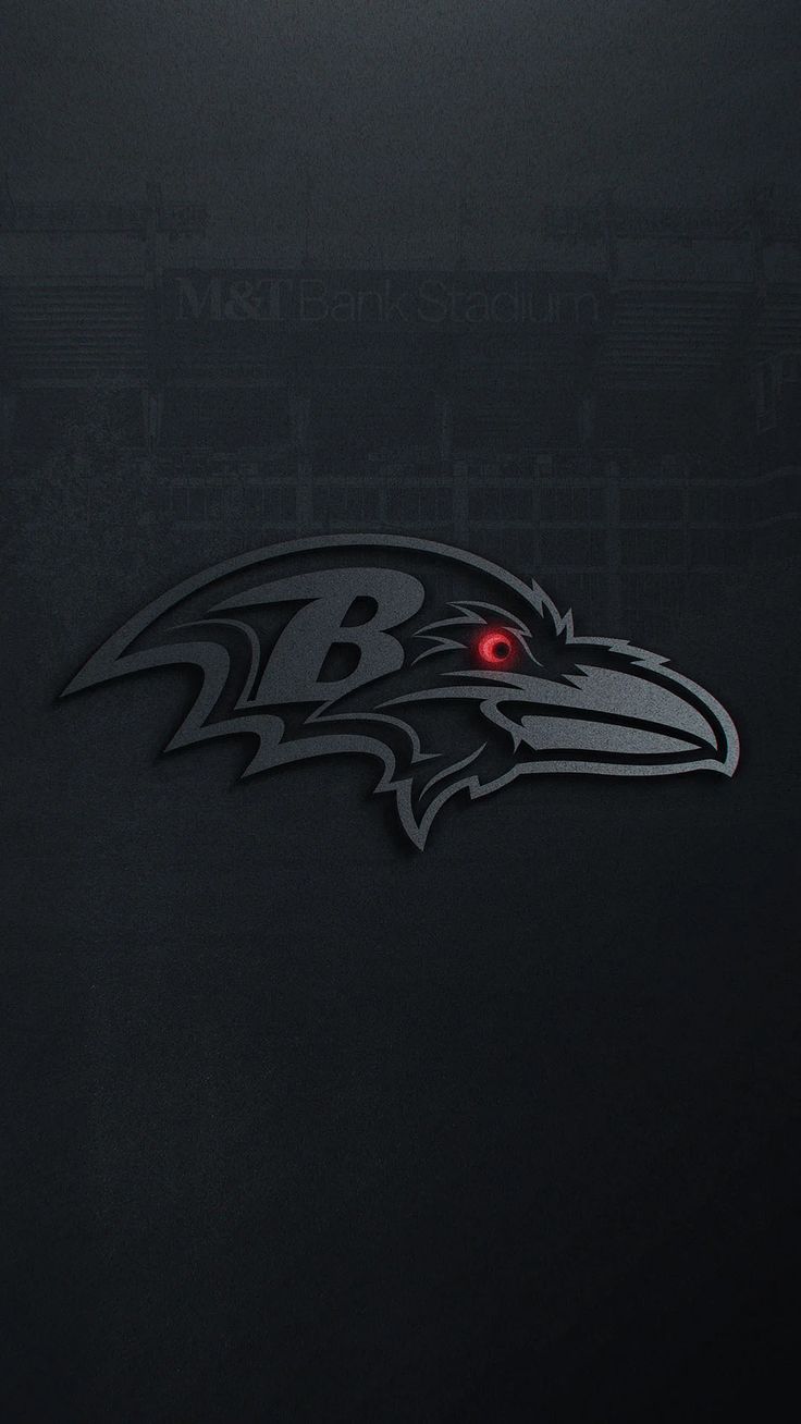 the baltimore ravens logo is shown on a black background in this image, it appears to be an eagle with red eyes