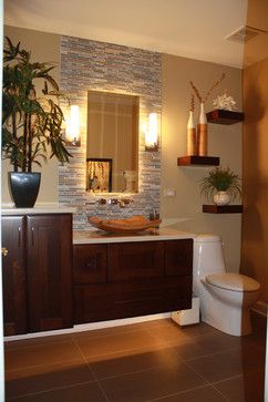 a bathroom with a toilet, sink and mirror in it's center piece is shown