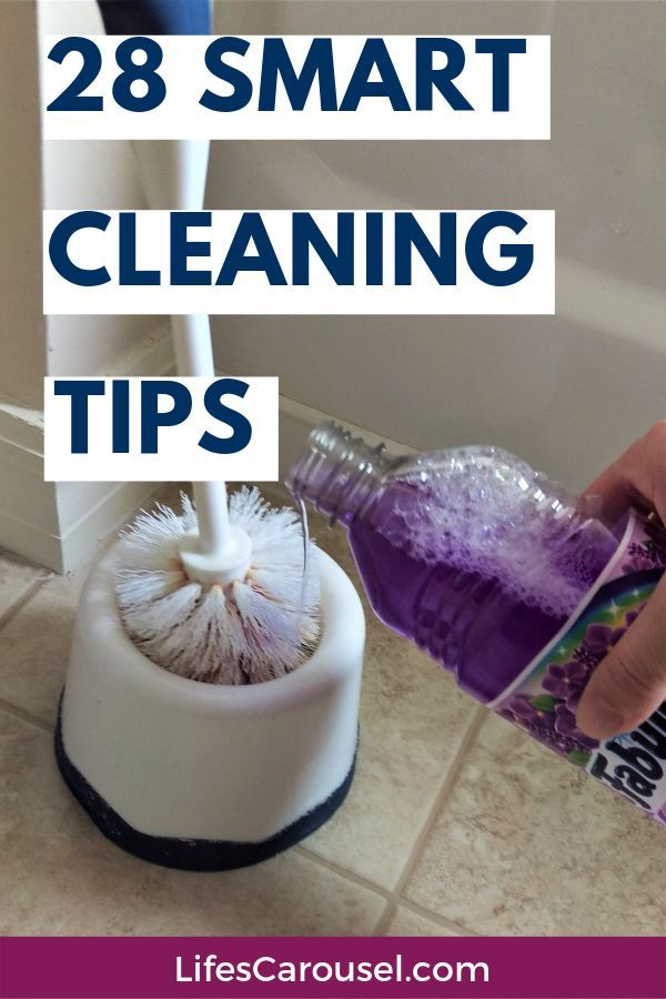 a person is cleaning the floor with a mop and purple liquid in front of them