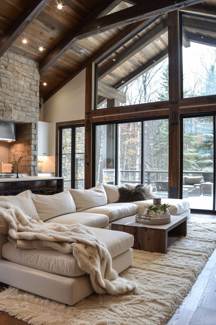 a living room filled with furniture and windows