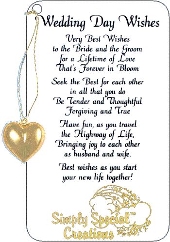 a wedding day wishes card with a gold heart hanging from the front and back of it