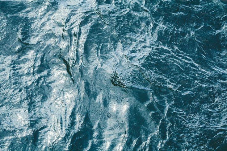 an aerial view of the ocean with waves