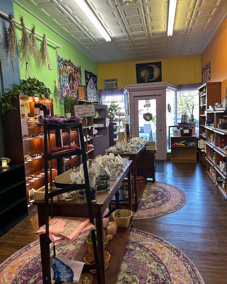 the inside of a store with lots of rugs