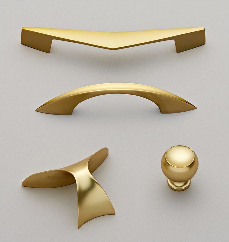 three different types of handles and knobs on a white surface