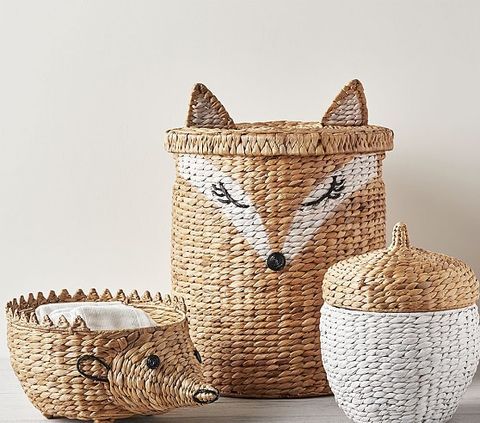 three woven baskets with animals on them and one has a basket in the shape of a fox