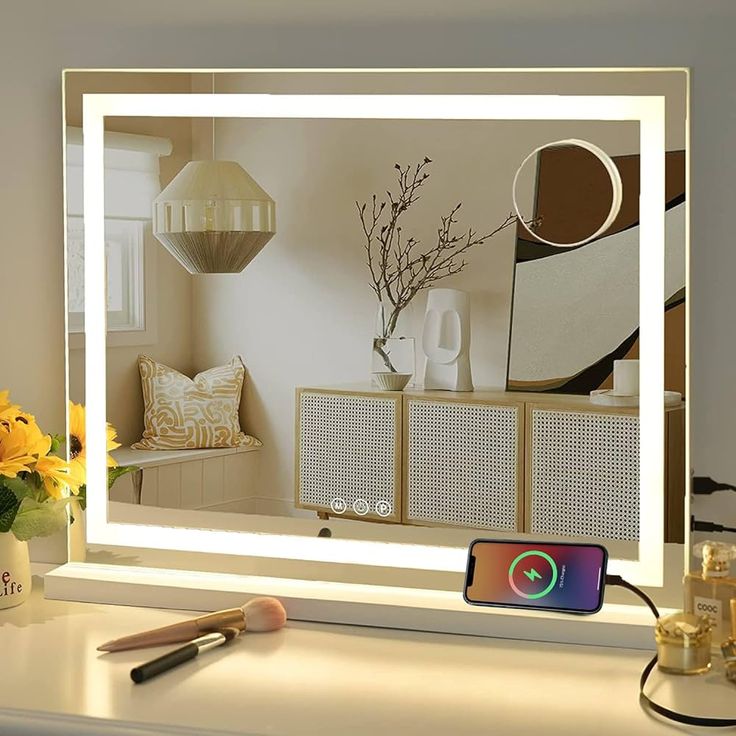 an image of a mirror that is on top of a desk with flowers in it