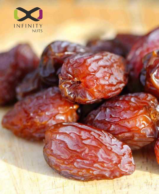 raisins on a wooden cutting board with the words infinitity foods