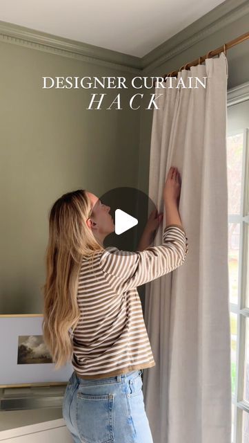 a woman hanging curtains on the side of a window with text overlay that reads, designer curtain hack