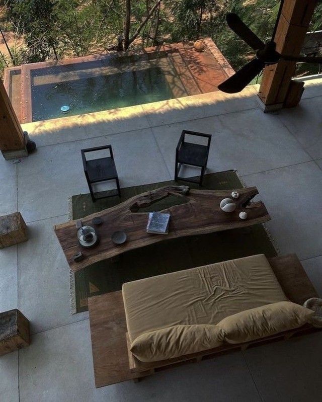 an aerial view of a living room and pool