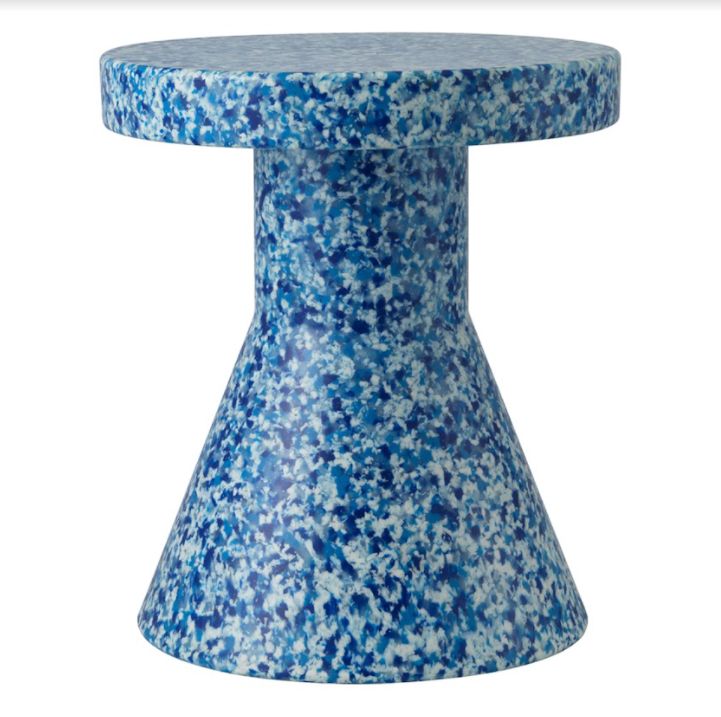 a blue and white vase sitting on top of a table