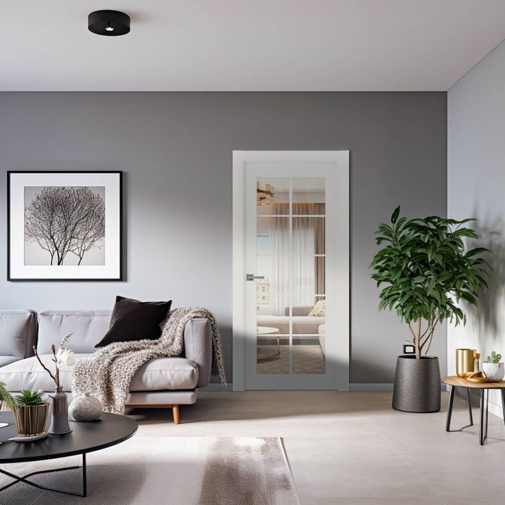 a living room filled with furniture and a potted plant