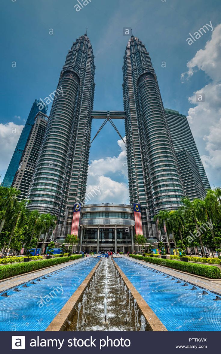 the twin towers in malaysia, with water running through them - stock image