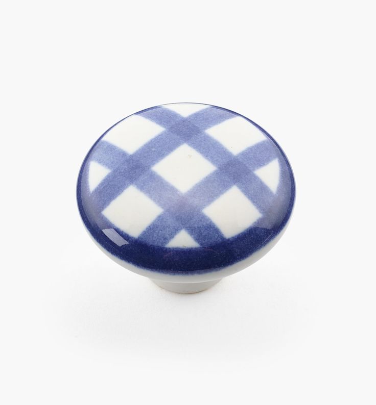 a blue and white checkered cabinet knob