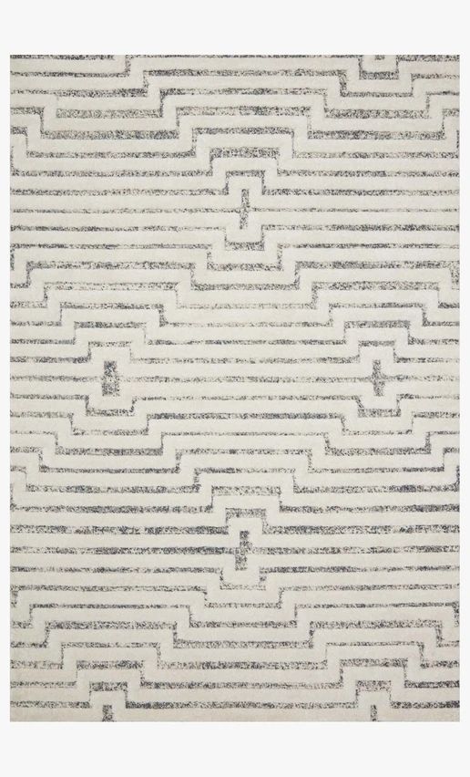 a white rug with black and grey lines on it