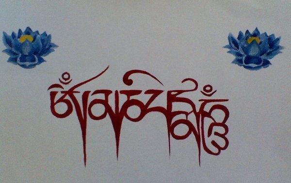 the word buddha written in red and blue ink on a white background with two lotuses