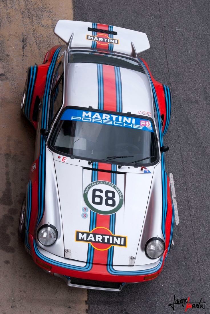 a porsche race car with the number 66 on it's side is seen from above