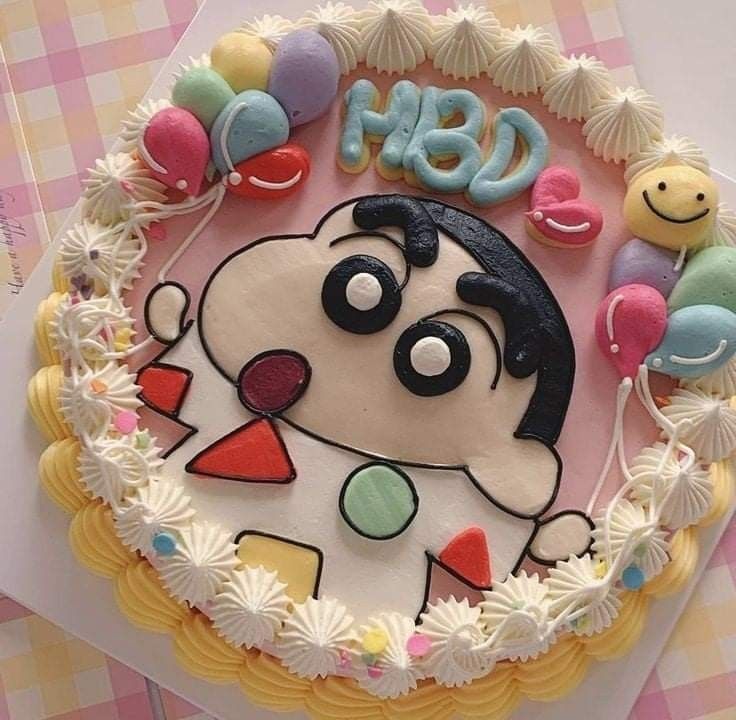 a birthday cake decorated with an image of a dog and balloons on the top layer