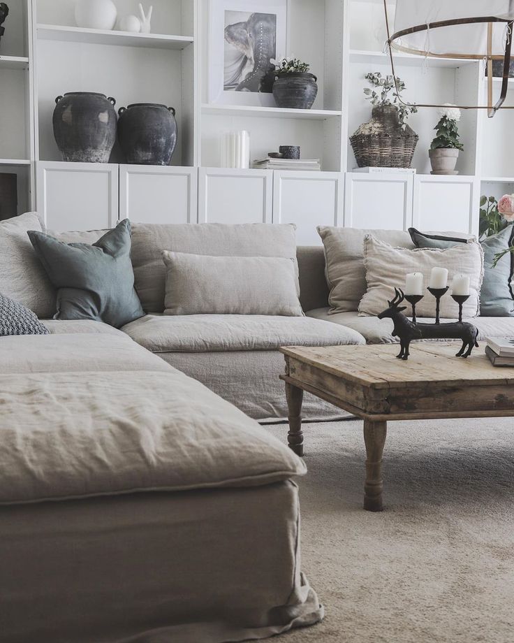 a living room filled with lots of furniture and decor