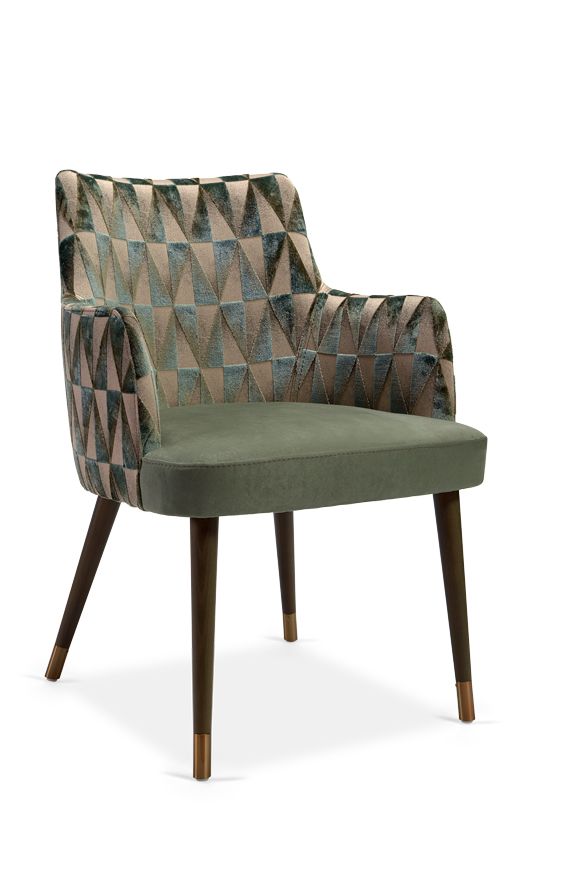 an upholstered chair with wooden legs and green fabric